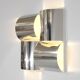 Contemporary wall light in stainless steel and metal.