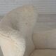 Fauteuil danois des années 1960, en véritable peau de mouton "Canberra", retapissé.