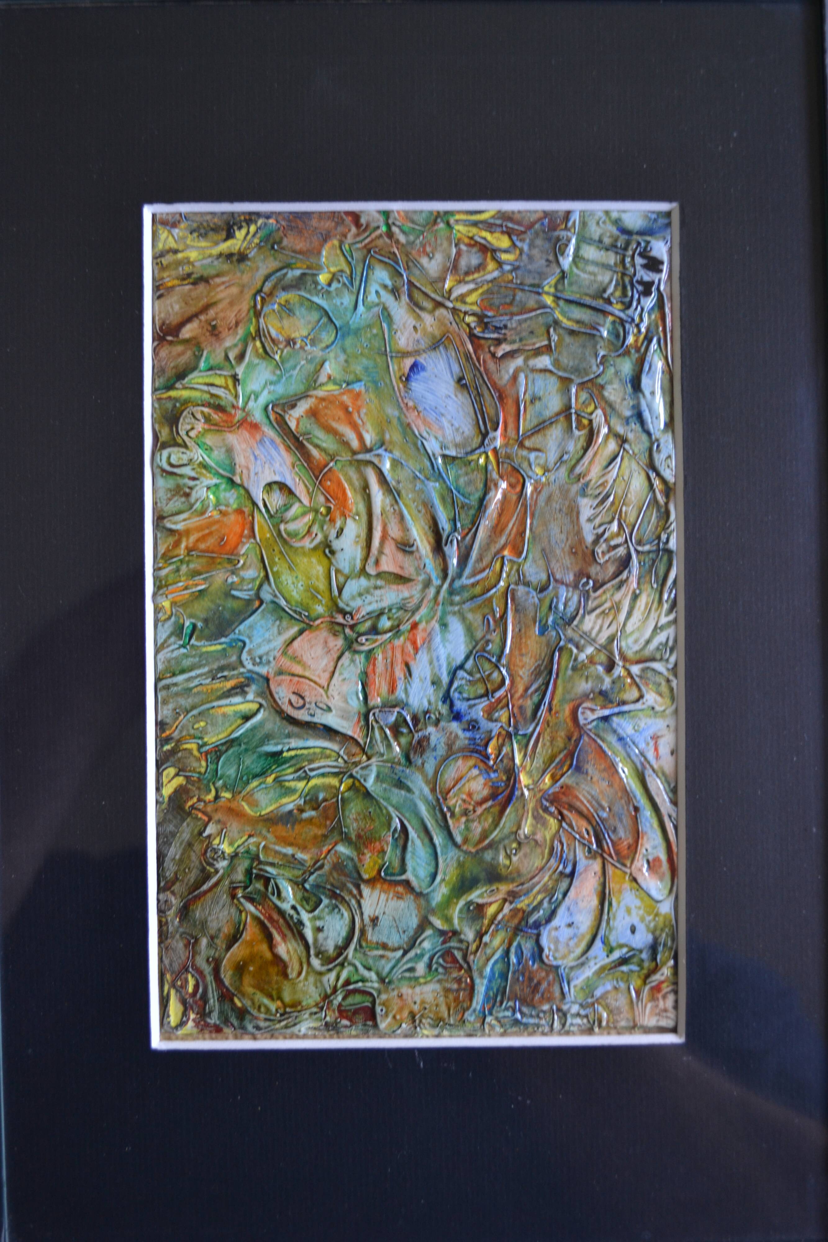 Framed abstract painting under glass