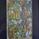 Framed abstract painting under glass
