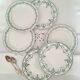 Old dessert plates mismatched in iron earth