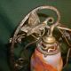 Art Deco lamp in glass paste and wrought iron leaves