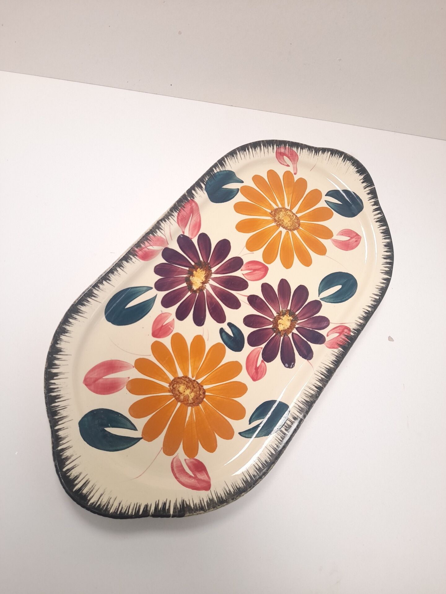 Floral cake dish in Boch brothers earthenware