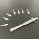 8 whale-shaped knife holders in silver metal