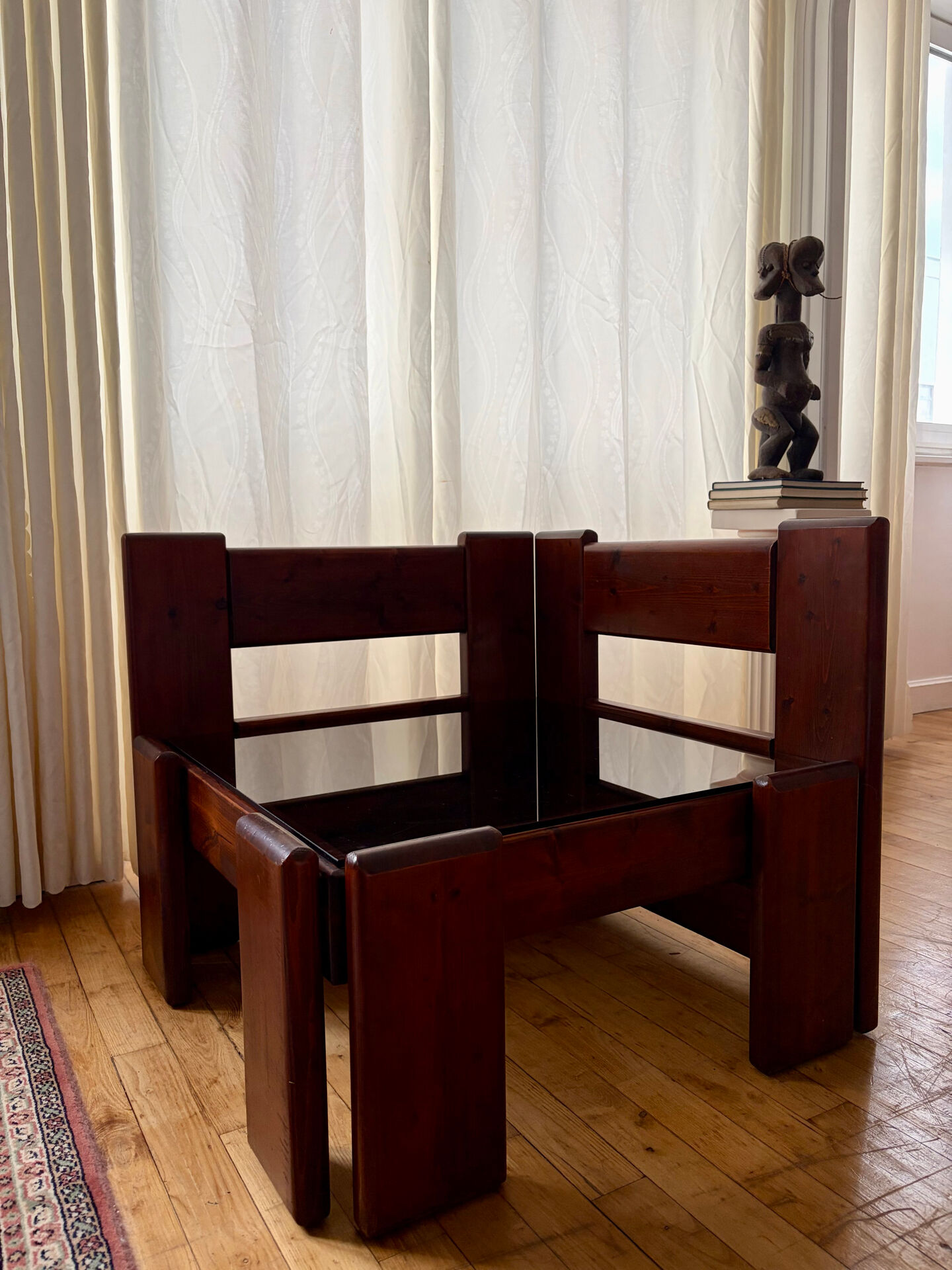 Modernist coffee table in wood and smoked glass.