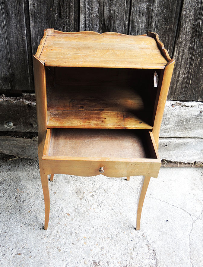 Old wooden bedside table heart pattern