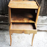 Old wooden bedside table heart pattern