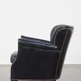 Subtle black armchair with reversible Kelim seat cushion