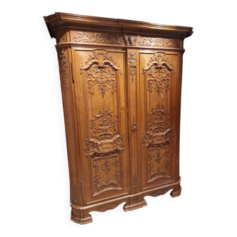Two-door solid oak wardrobe in Liège Regency style.
