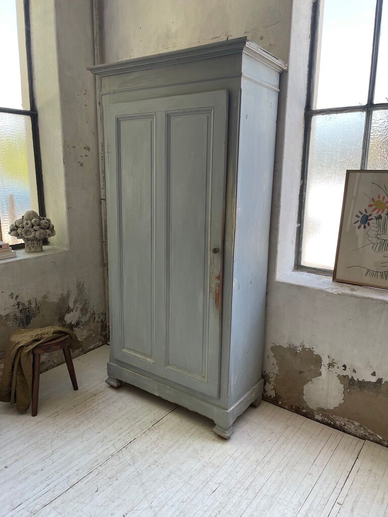 Blue patinated cap cabinet