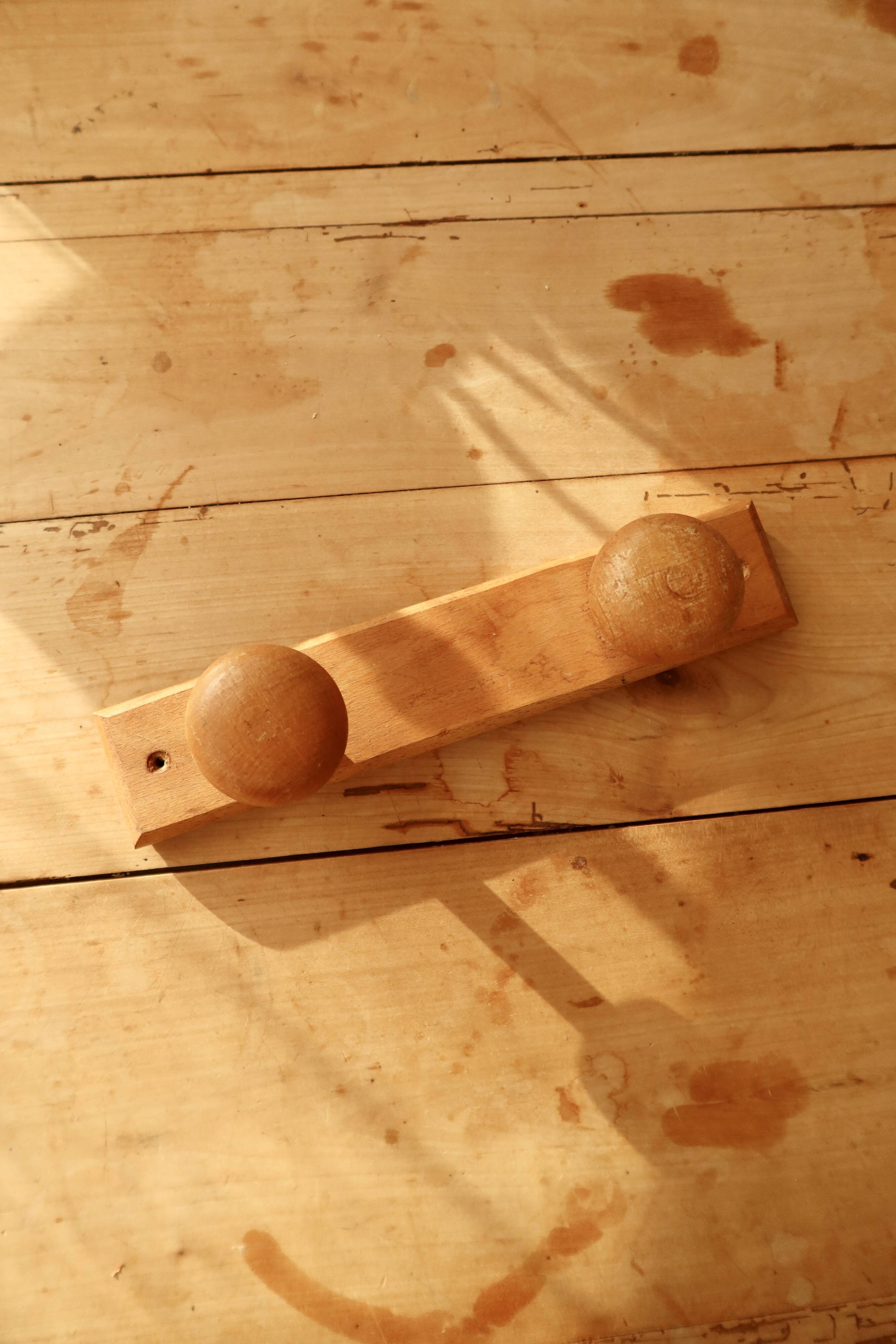 Vintage wall coat rack in pine with 2 hooks.