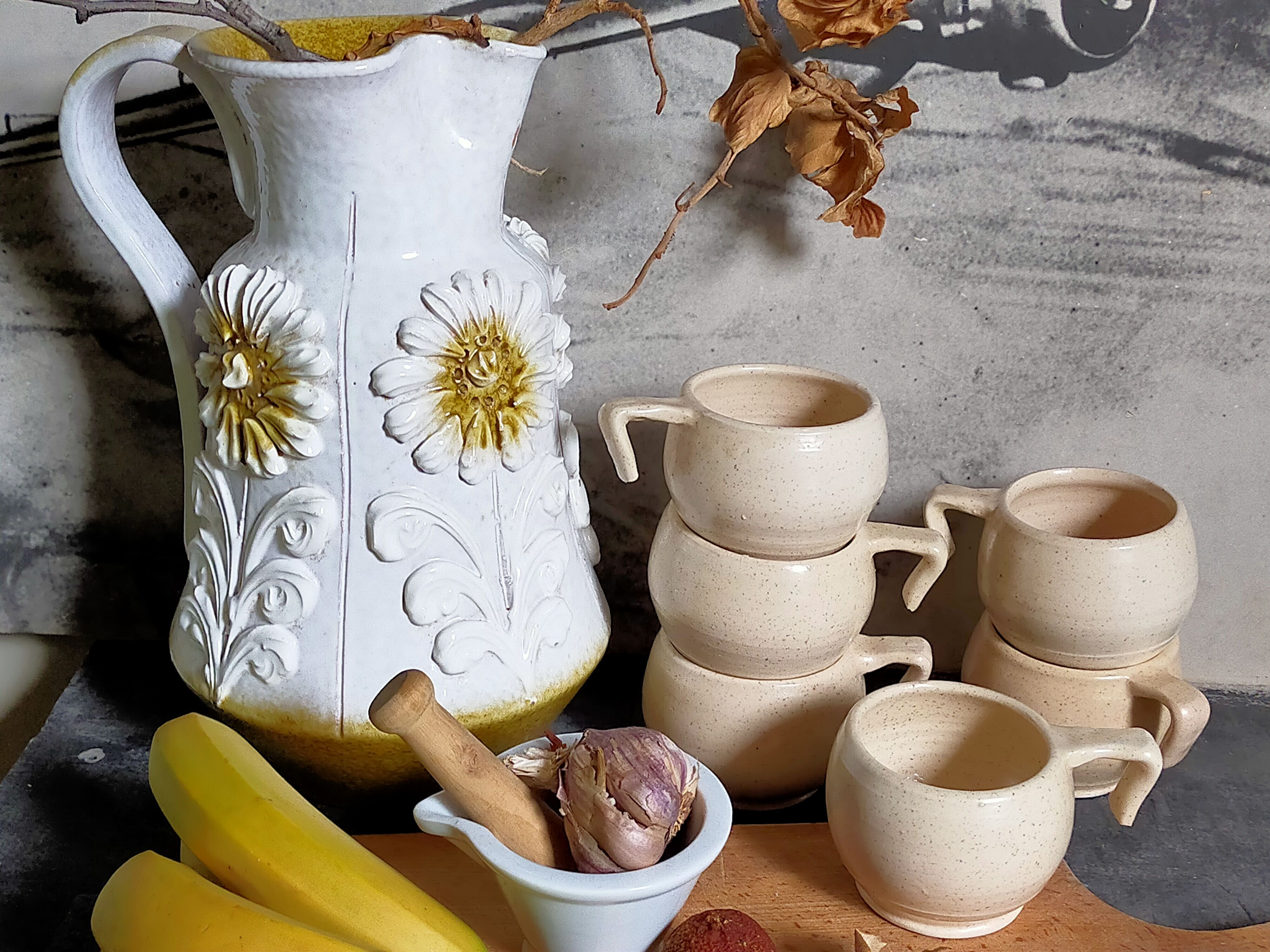 Six vintage potter's ceramic cups with vanilla enamel