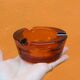 Amber glass ashtray