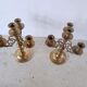 Pair of four-light candle holders in gilded brass