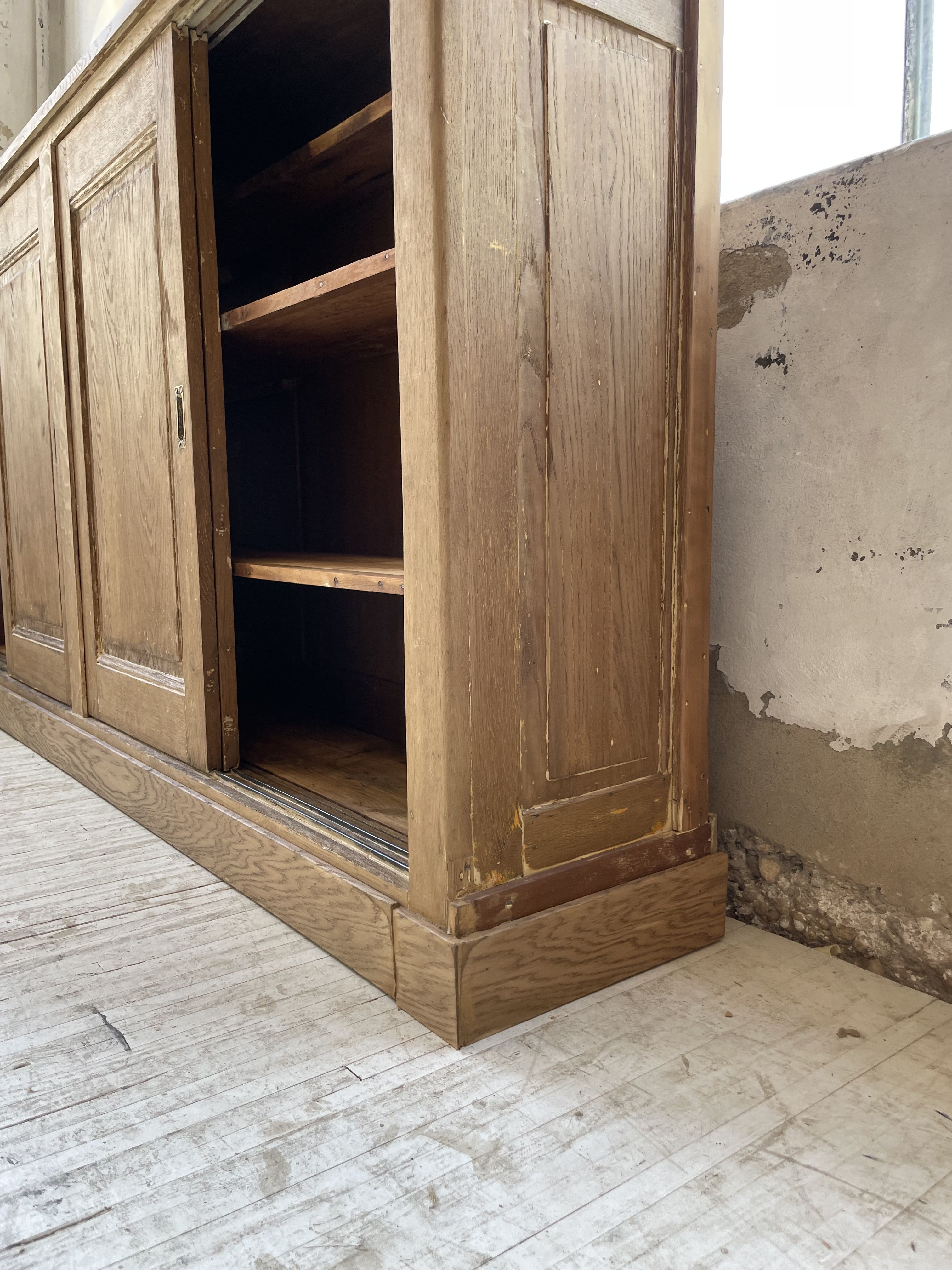 Large row of solid oak loom sliding doors