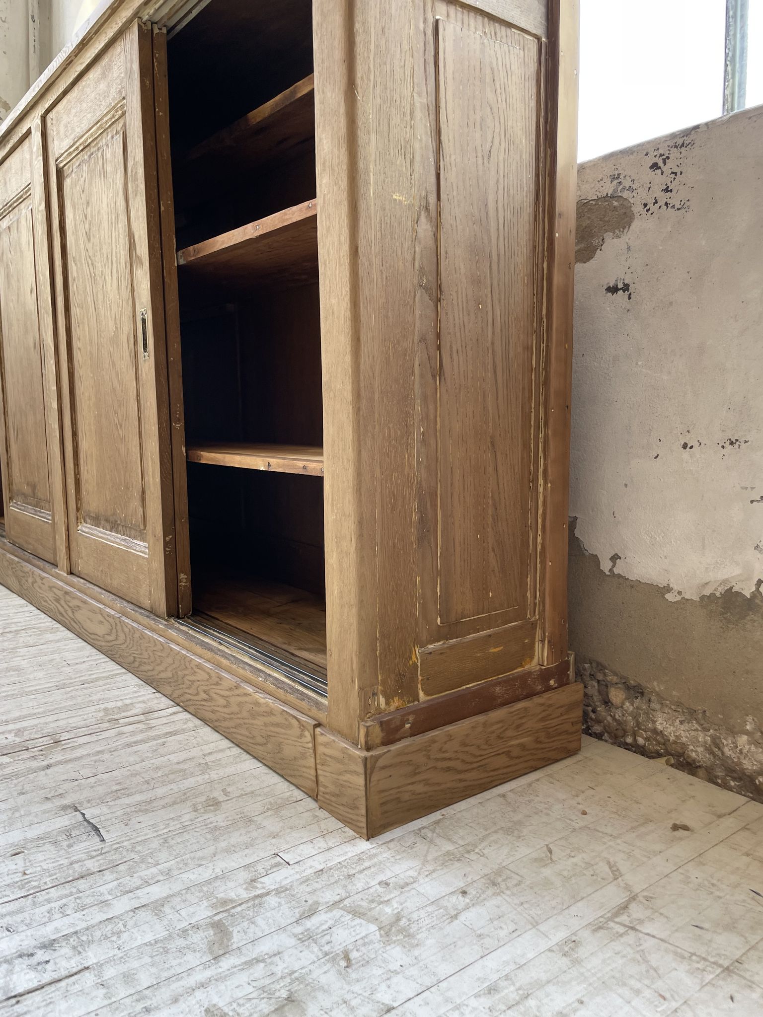 Large row of solid oak loom sliding doors