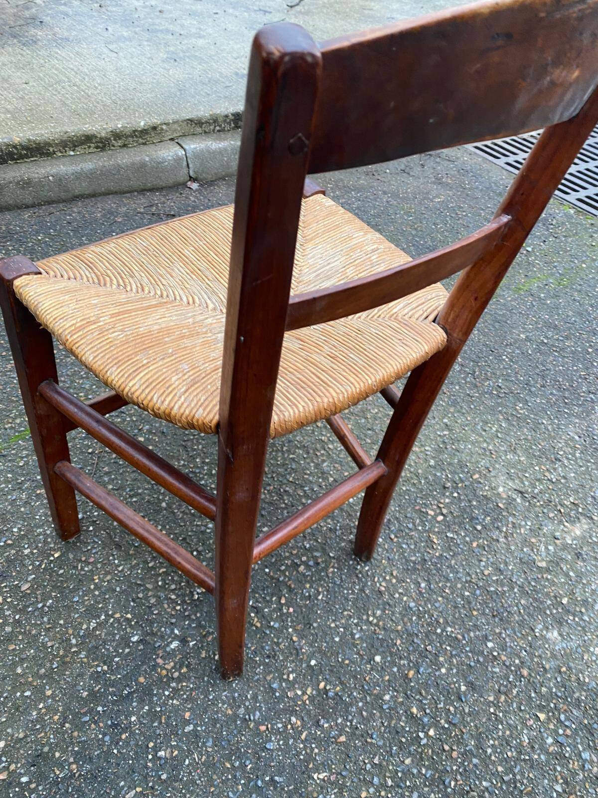 2 solid wood chairs with rush seats, child size.