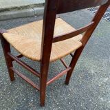 2 solid wood chairs with rush seats, child size.
