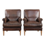 Set of two characterful sheepskin armchairs with a beautiful deep colour