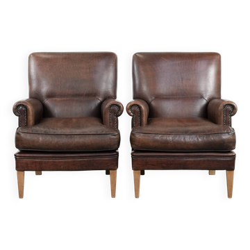 Set of two characterful sheepskin armchairs with a beautiful deep colour