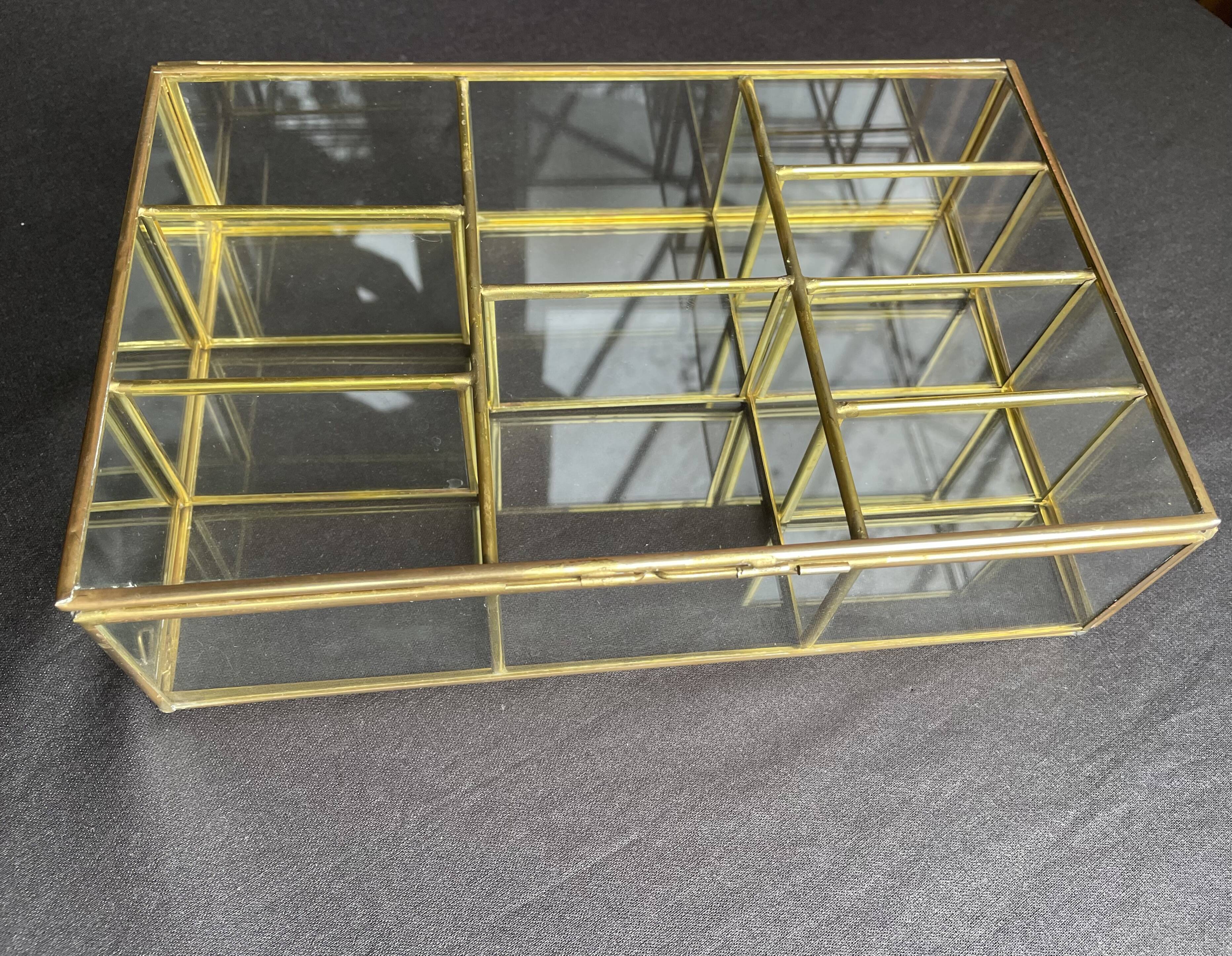 Glass and brass wall display case
