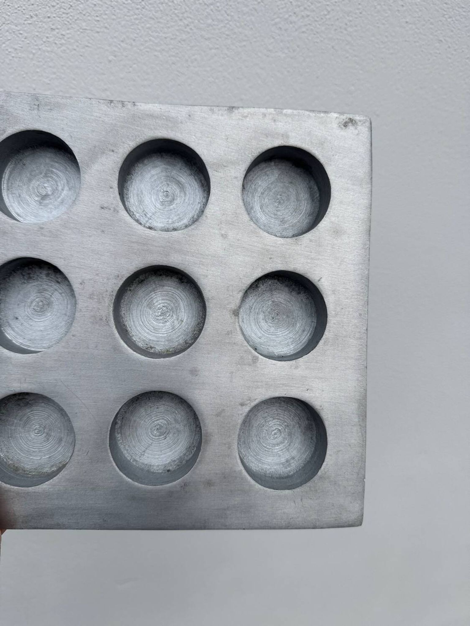 Brutalist style brushed aluminum candle holder