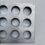 Brutalist style brushed aluminum candle holder