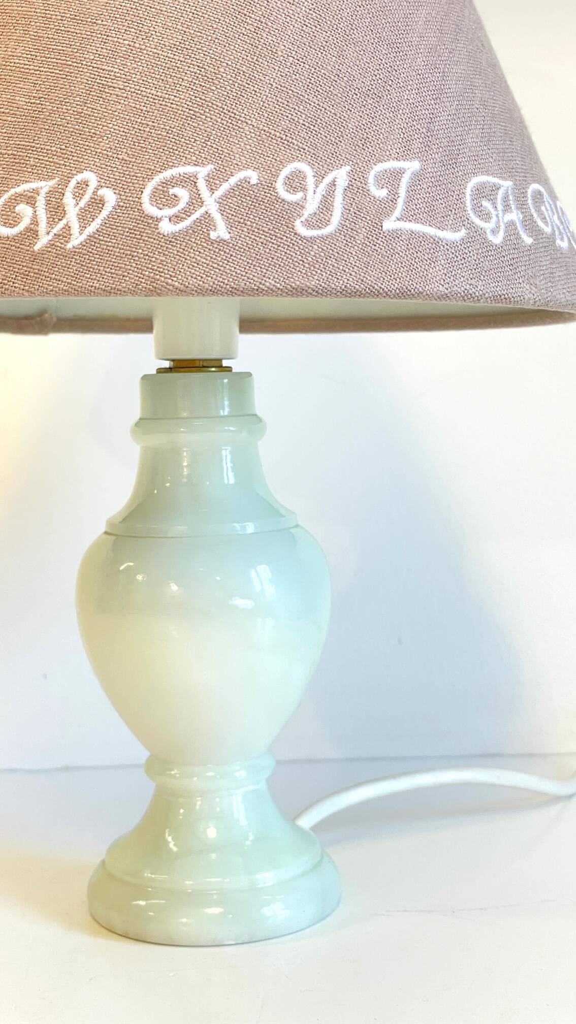 White marble lamp and vintage linen