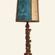 Renaissance table lamp in polychrome carved wood with cherubs.