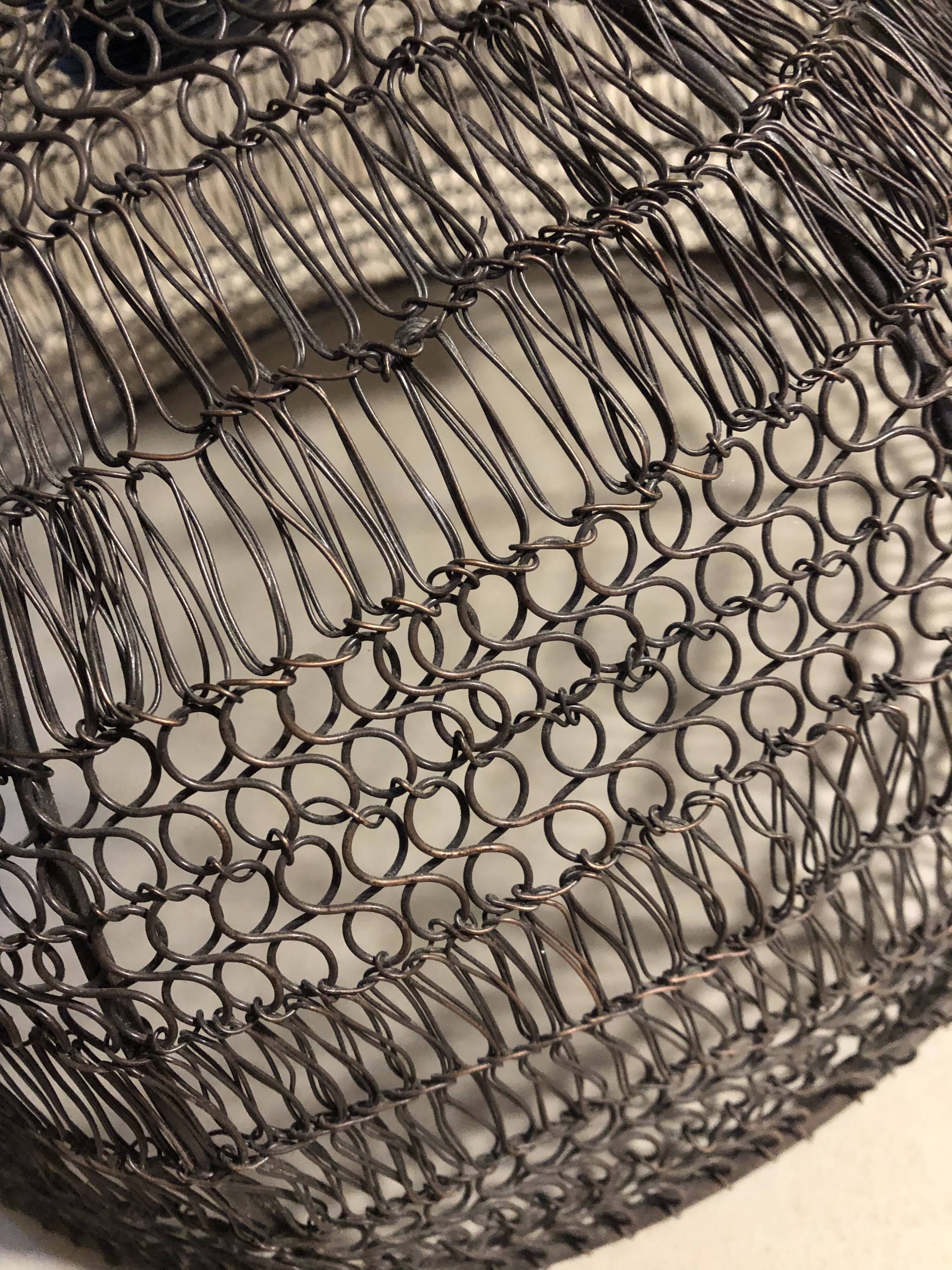 Woven metal suspension