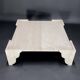 Large square coffee table in travertine by Claude Berraldacci. 1990s. France.