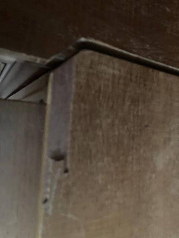 Ancien meuble de pharmacie en angle