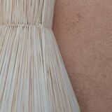 Handmade conical raffia wall light