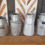 Set of 4 old metal milk canister jars