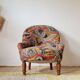 Small "madame" toad chair, vintage, upholstered in multicoloured floral fabric.