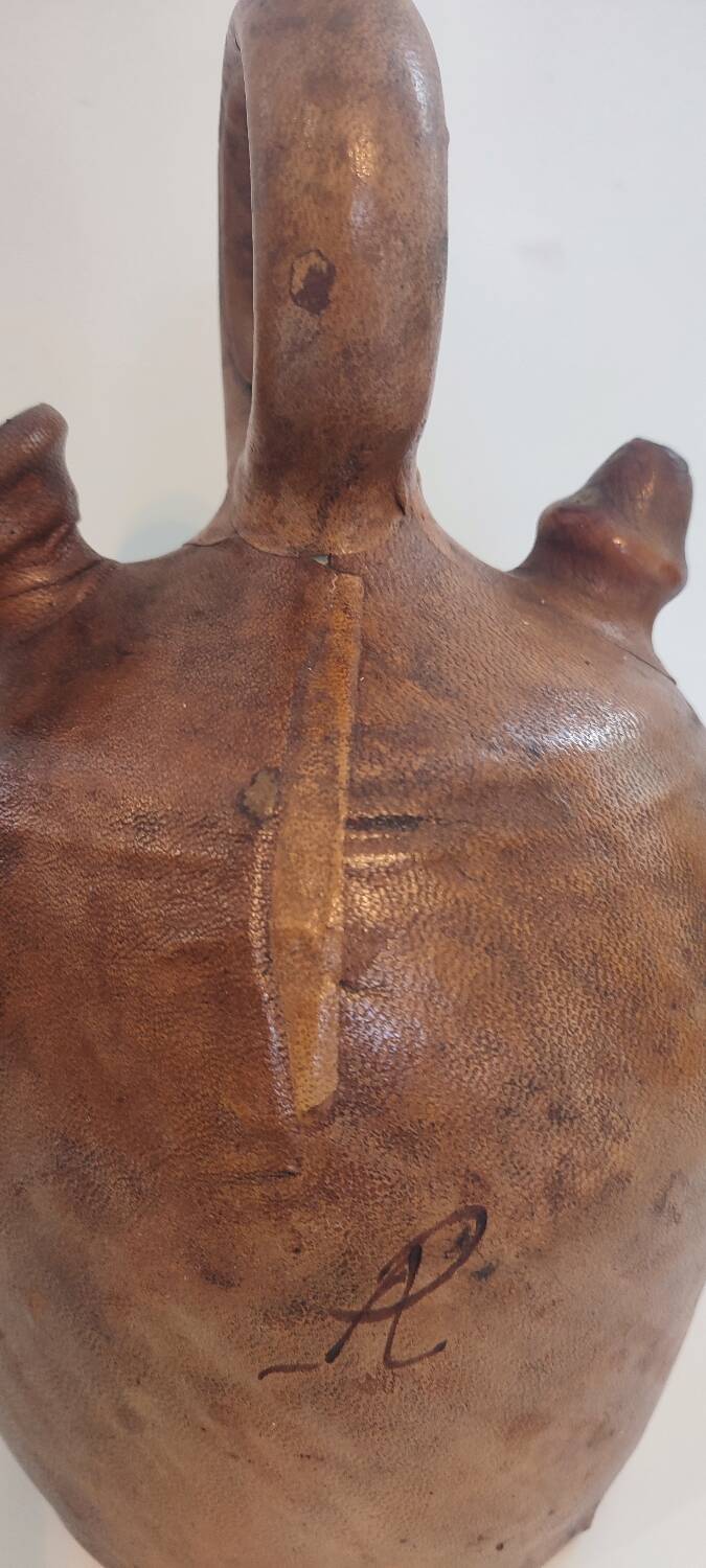 Gargoulette, terracotta jug covered with leather