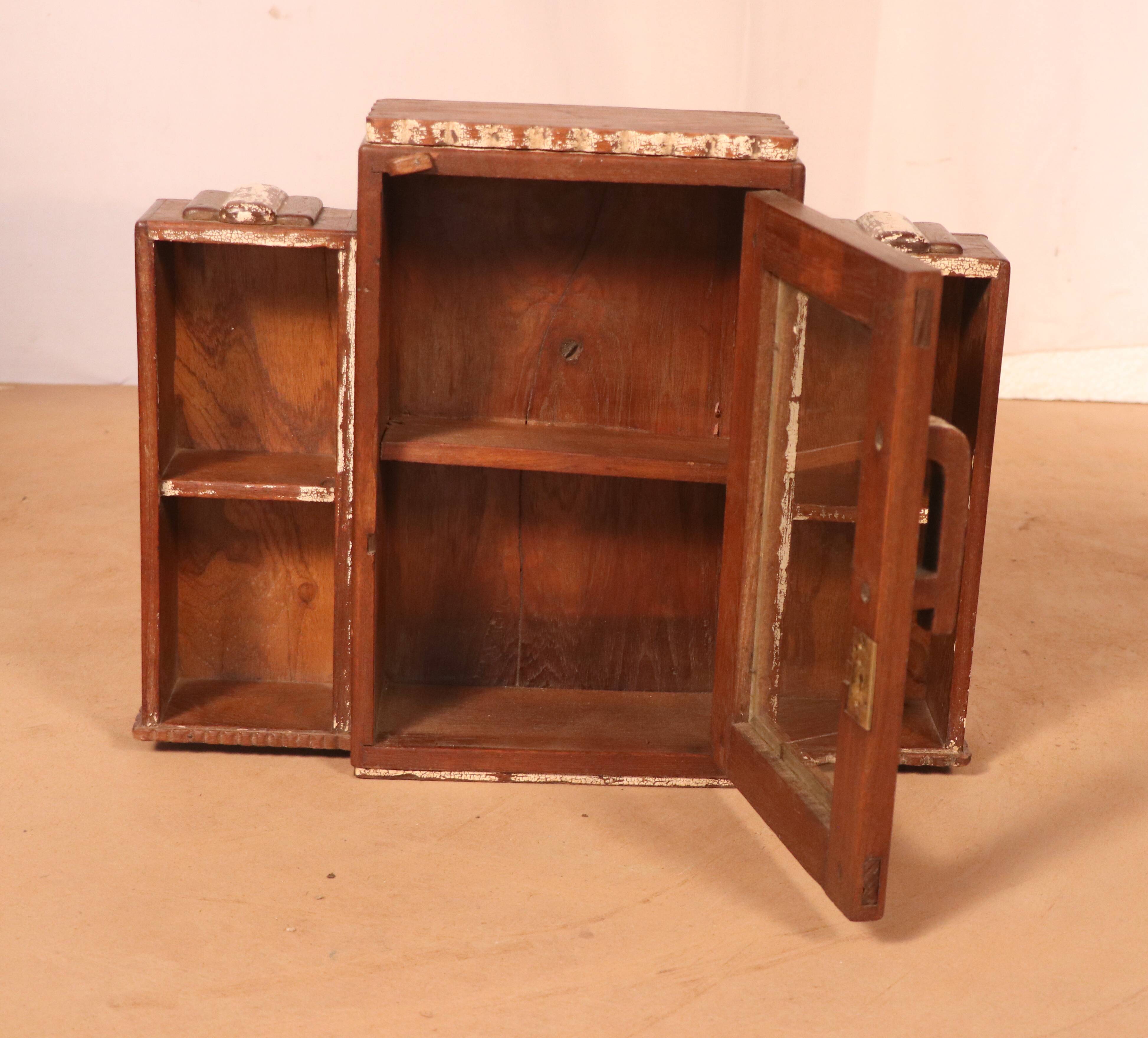Old art deco showcase in burmese teak with original white edging