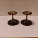 Pair of black brass candlesticks
