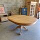Round cherry table with 2 extensions.