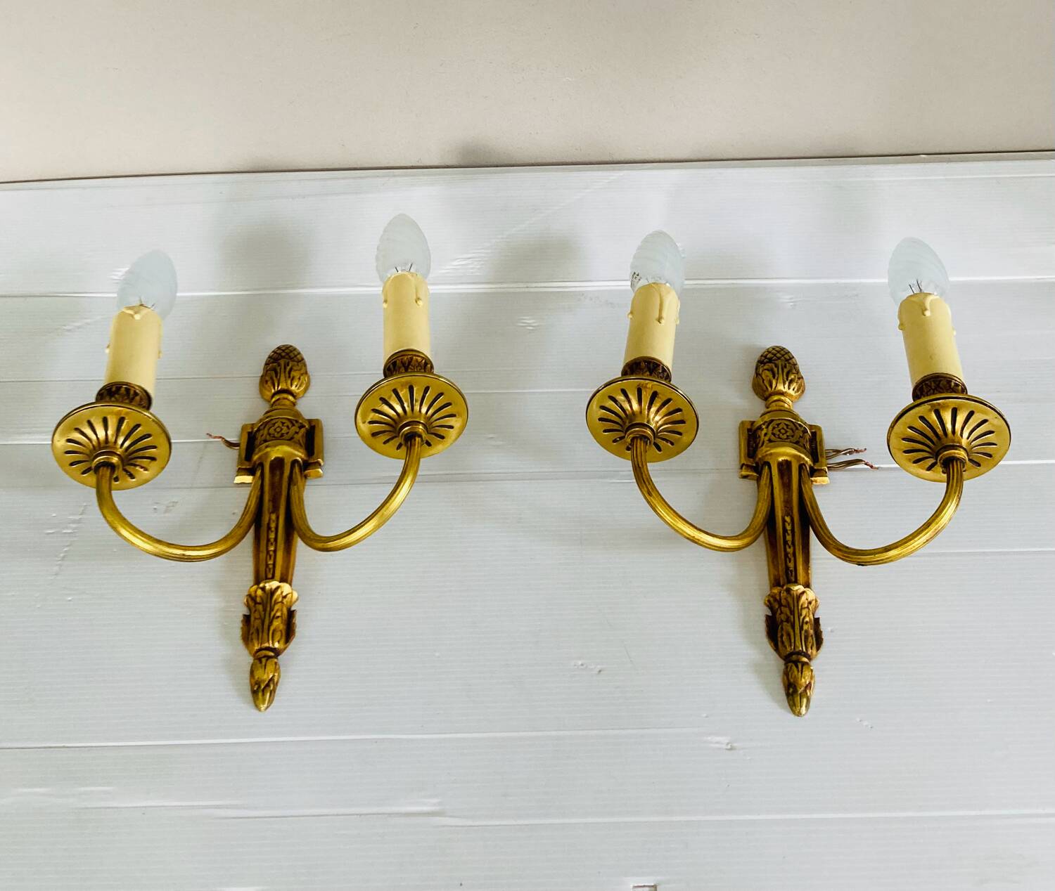 St Louis XVI gilded bronze wall lights with foliage and pine cone decorations