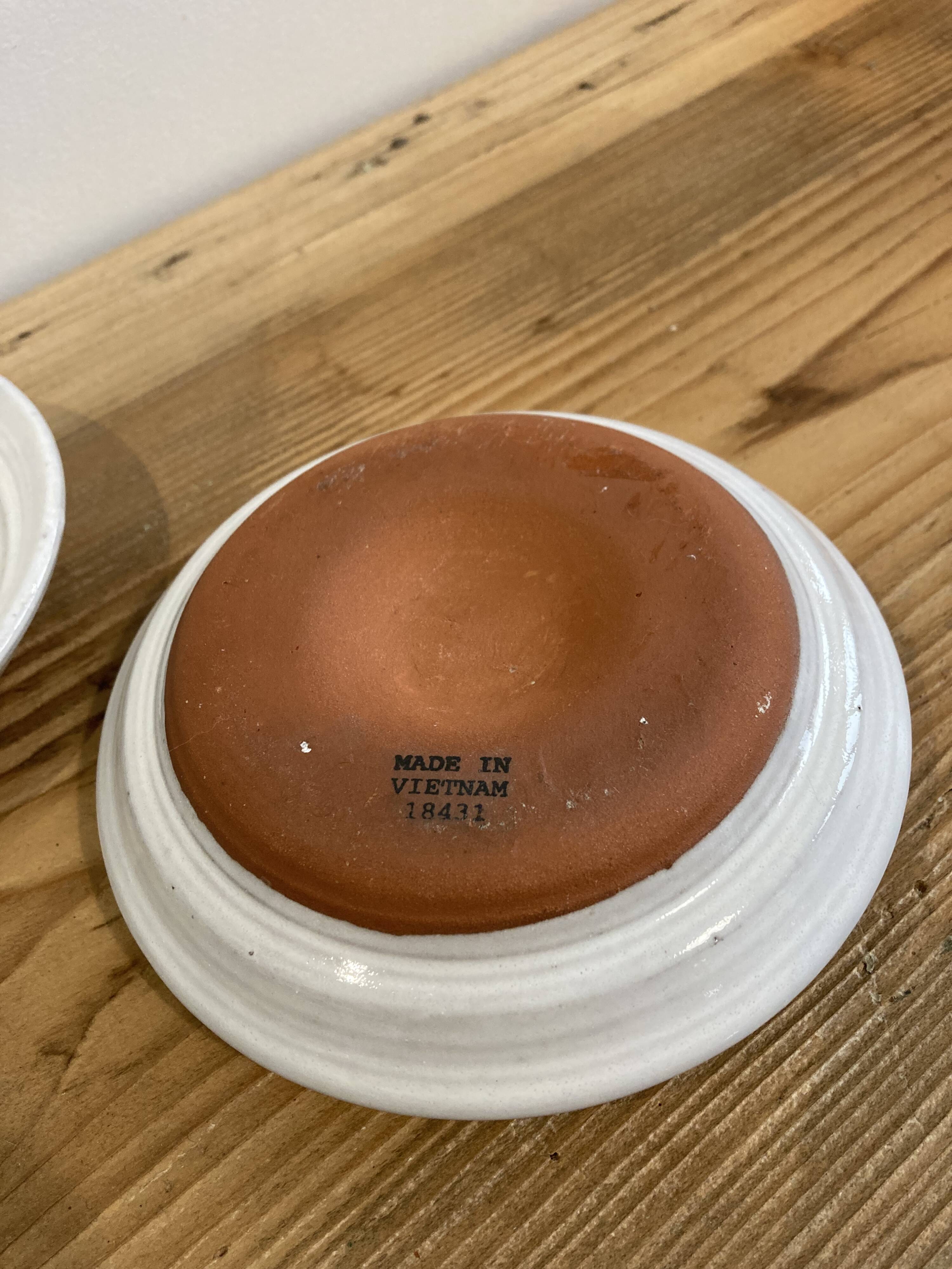 Pair of enamelled ceramic candlesticks
