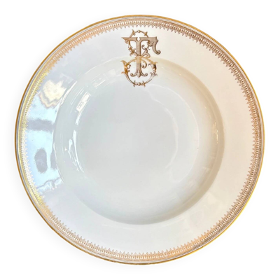 Assiette creuse en porcelaine dorée monogrammée ''F