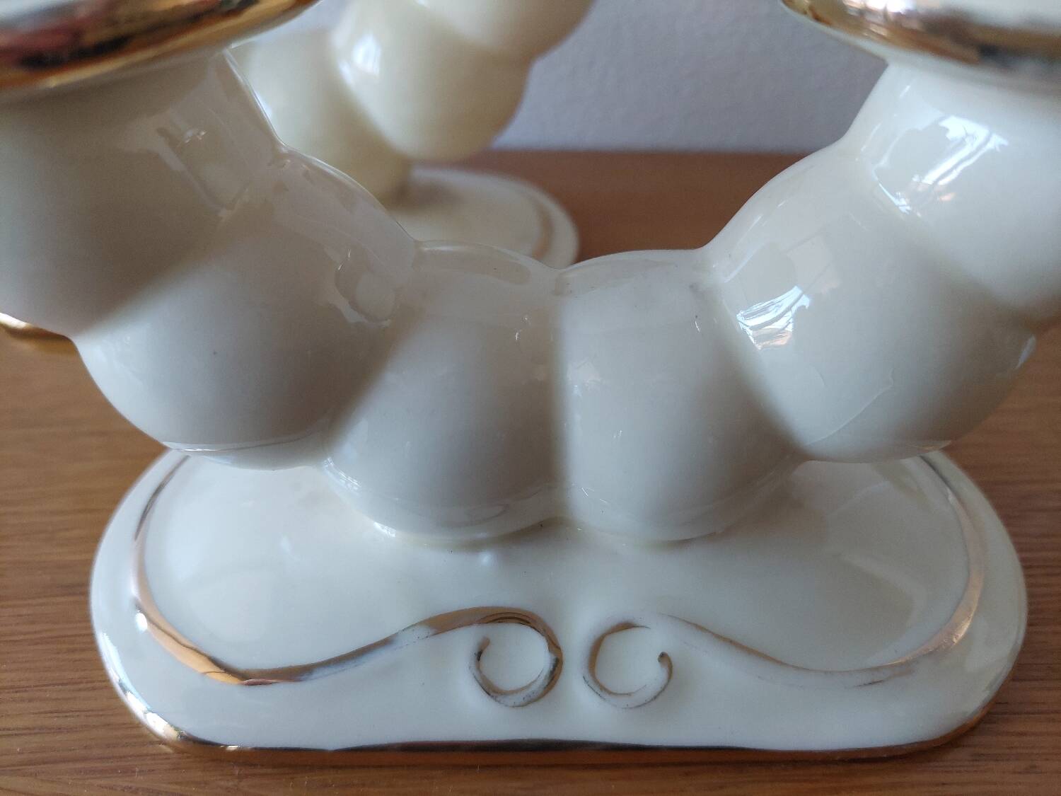 Pair of cream ceramic candlesticks with gold trim circa 1930-1950