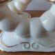 Pair of cream ceramic candlesticks with gold trim circa 1930-1950