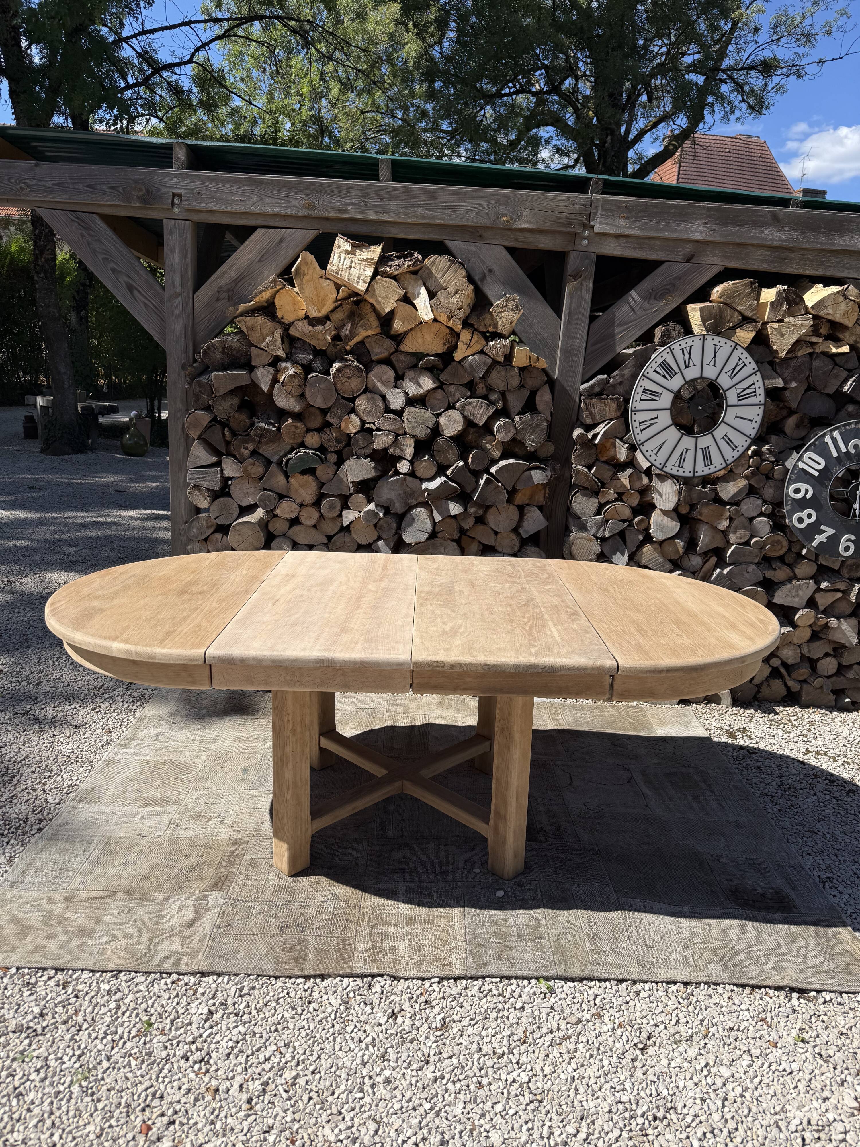 Round solid oak table with extensions, maximum 220cm.