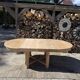 Round solid oak table with extensions, maximum 220cm.