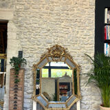 Mirror with parecloses with pediment, gilded with gold leaf