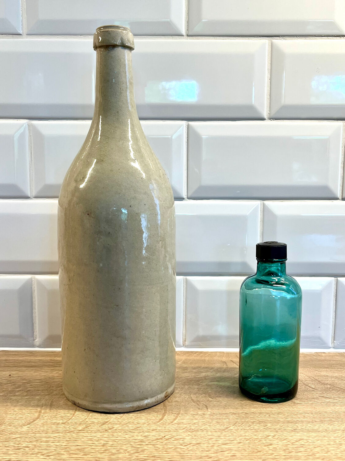 Small vintage dark turquoise blue bottle