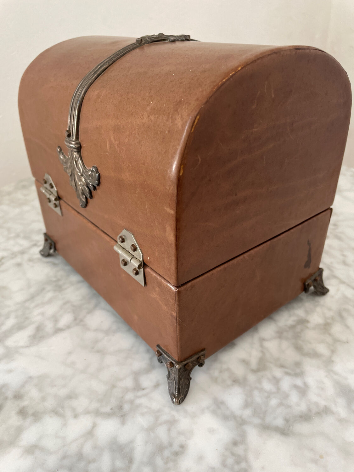 Vintage leather and silver metal jewelry box.