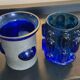 Duo of Art Deco candlesticks in blue glass paste